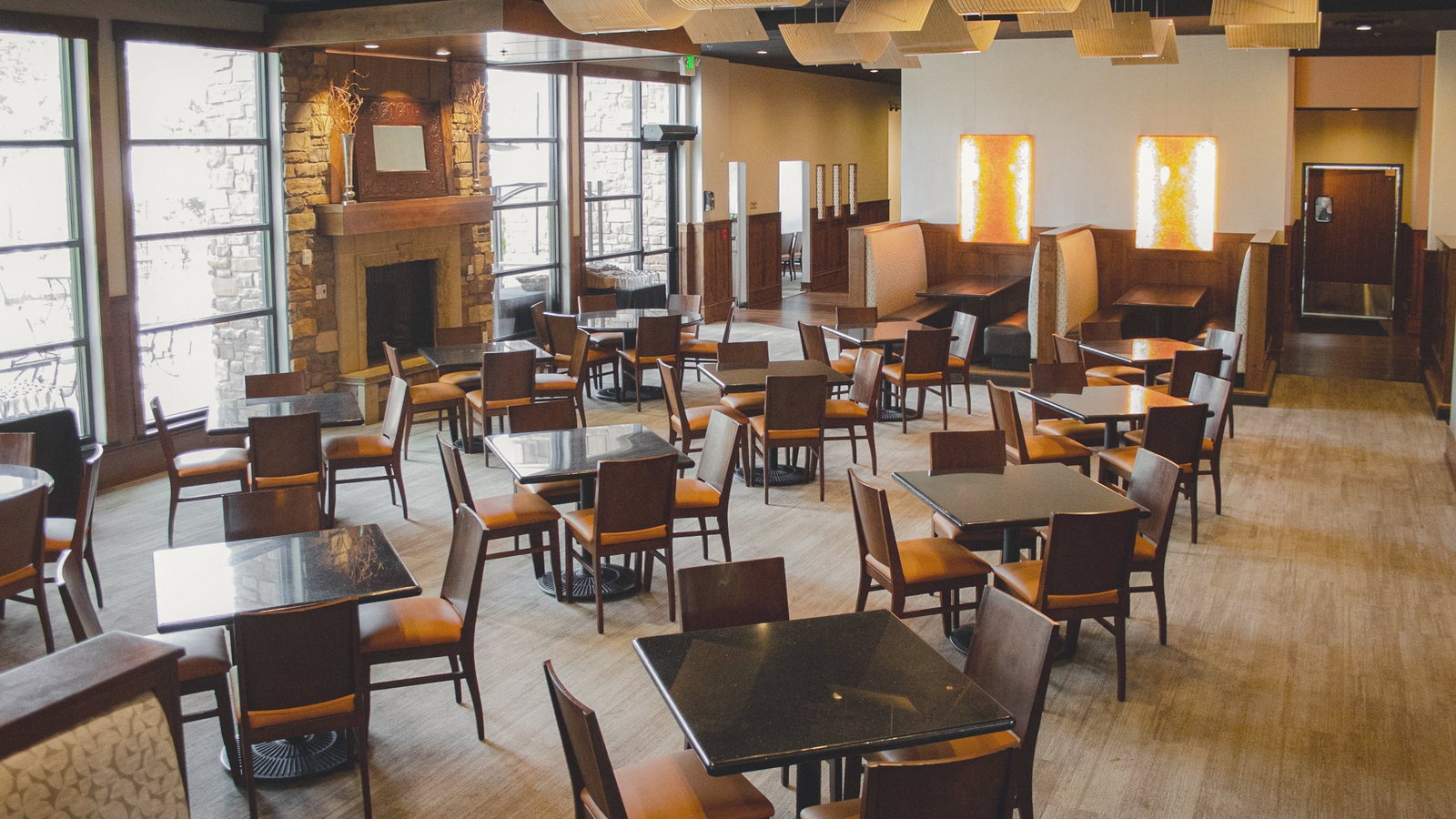 The main dining room looking toward the window wall and the Logan River.