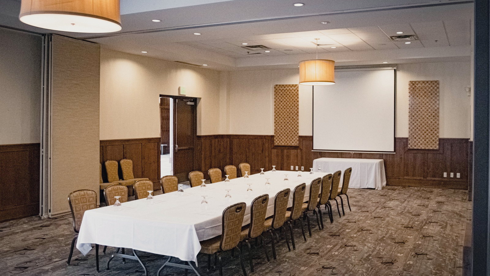 The Maple room, private dining, set with one long table. 1,146 square feet, up to 60 guests.